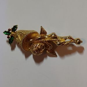 Corel Angel hanging from a bell brooch